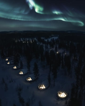 Das Polarlicht tanzt über den Glasdachhhütten